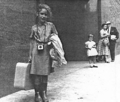 Carole returning from her first full time camping experience. Arriving at the 40th Street Bus terminal in 1956 after spending two weeks in a girl scout camp